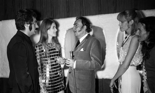 Perfectly shapely songstress Francoise Hardy (second left) became a fan of plastic armour - pictured here in 1968 in the company of Paco Rabanne (first left), Salvador Dali (third left) and Amanda Lear. Photo by REPORTERS ASSOCIES/Gamma-Rapho via Getty